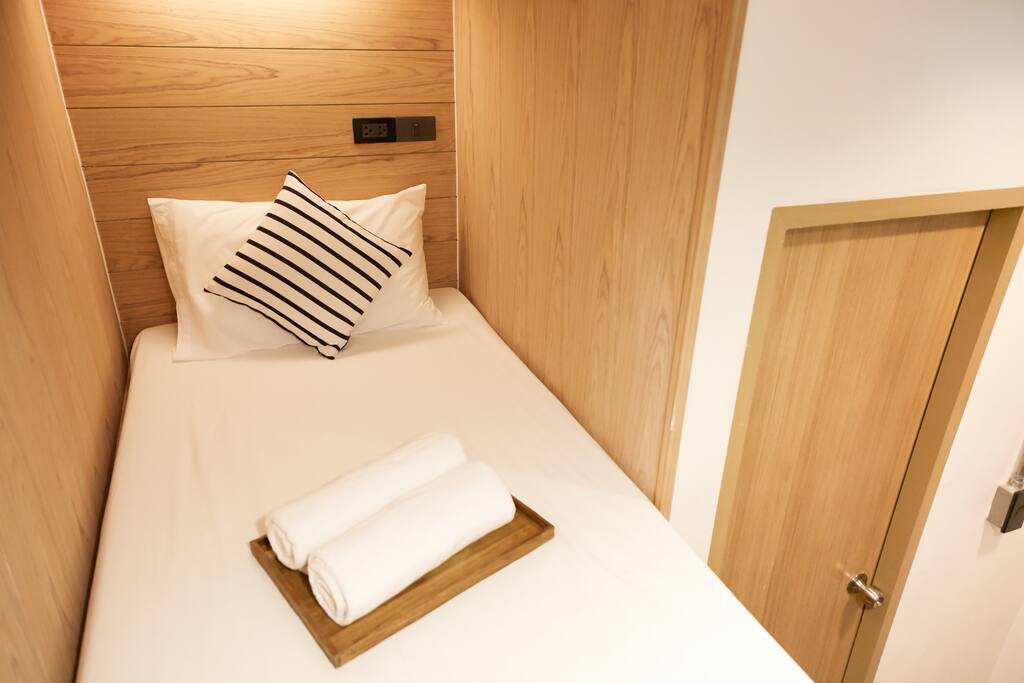 Twin bunk bed (upper bed) the door shown is bathroom door.