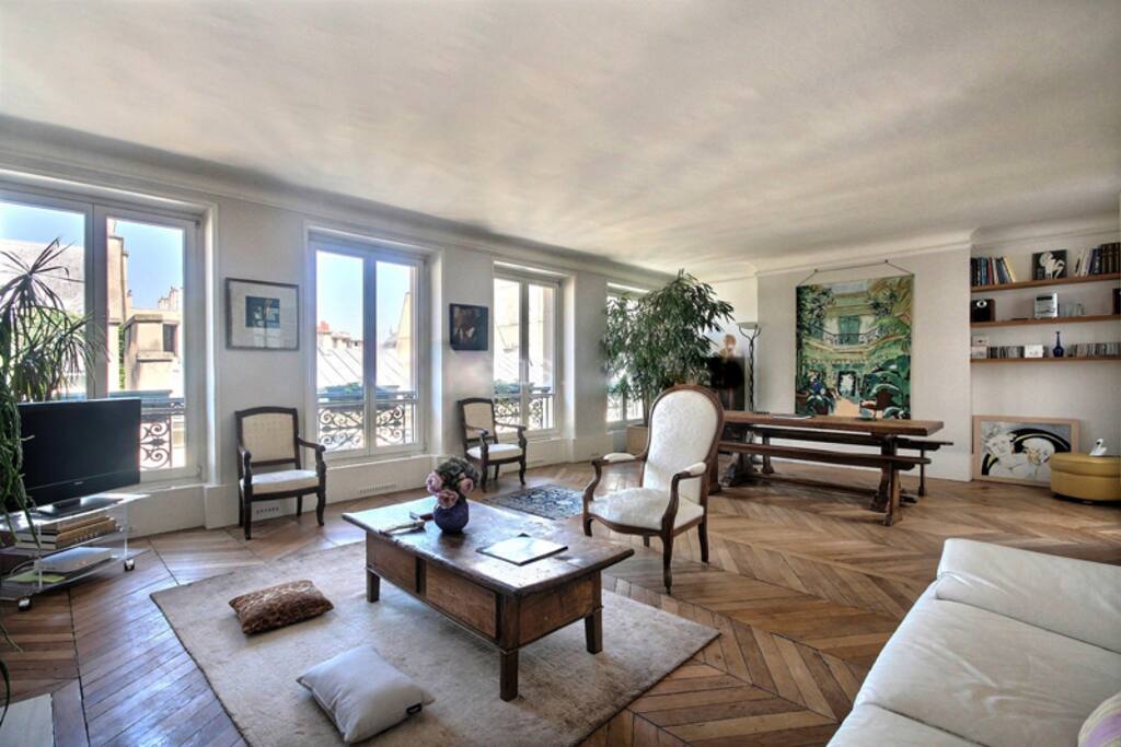 Living
The 42 square meters living room has 2 double glazed windows facing street . It is equipped with : sofa, coffee table, TV, 2 armchairs, decorative fireplace, hard wood floor, phone.