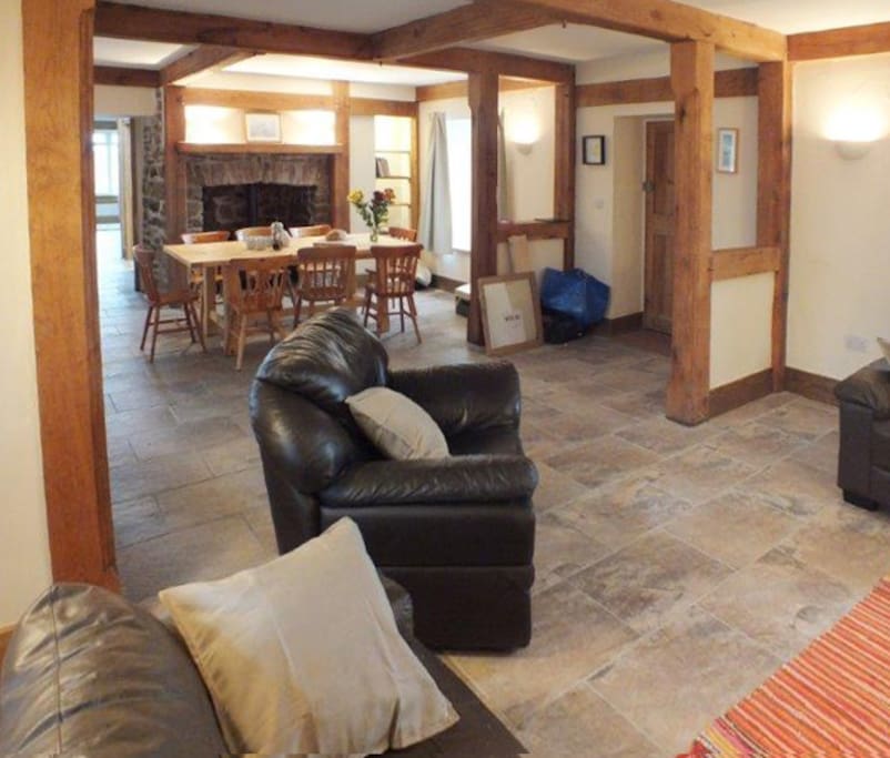 The openplan groundfloor living and dining room has two wood burning stoves