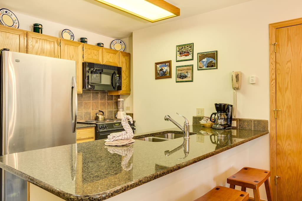 Our modern, well-equipped kitchen with seating for 3 at the breakfast bar