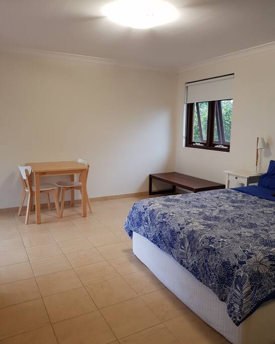 Beautiful space with queen size bed and small dining area