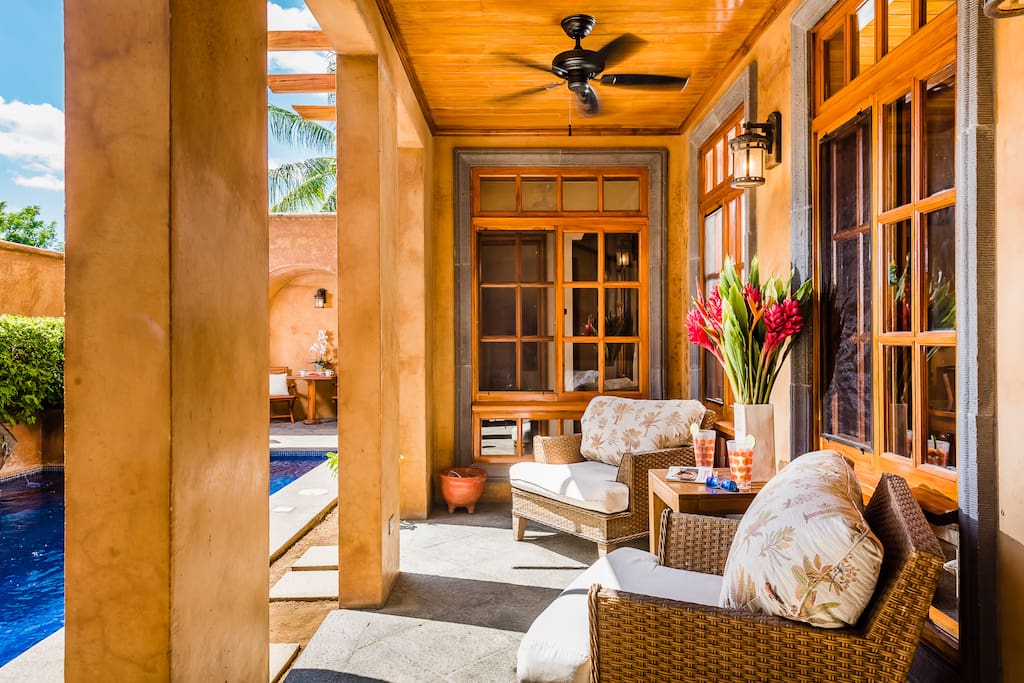 Comfortable poolside seating in the shade