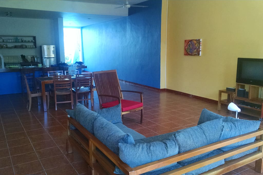 view through sala towards open bedroom and pool area