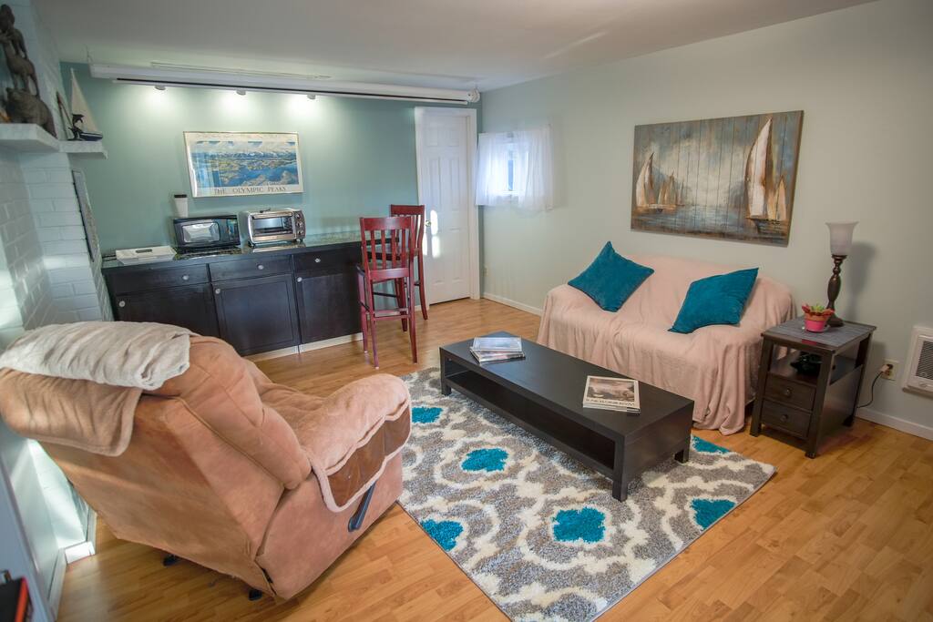Living room with full-size fridge, coffee pot (coffee and tea provided), microwave and toaster oven