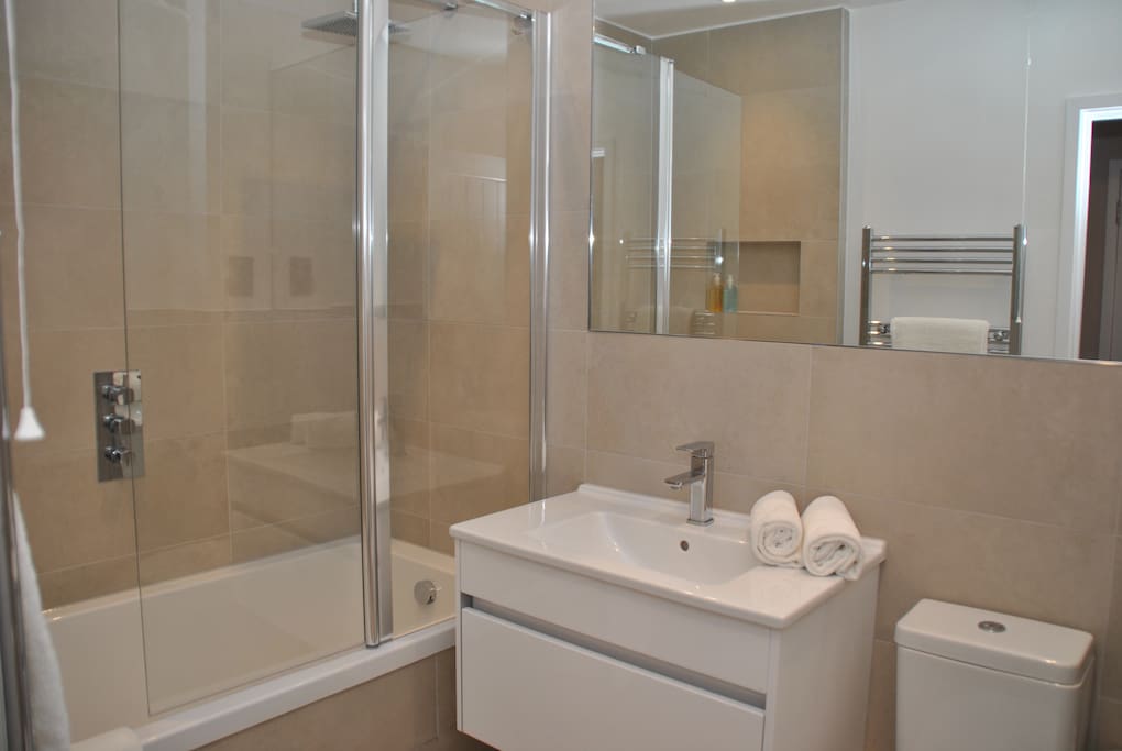 brand new bathroom with shower over bath