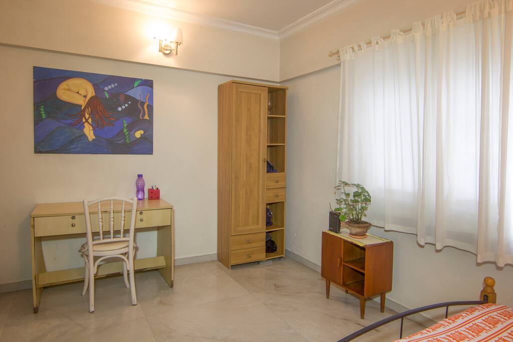 A view of the worktable and storage units in the bedroom