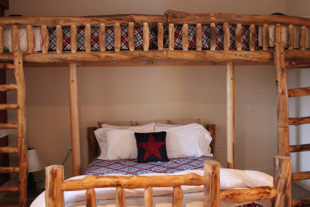 Upstairs bedroom. Sleeps 5 in beds with a private bathroom.