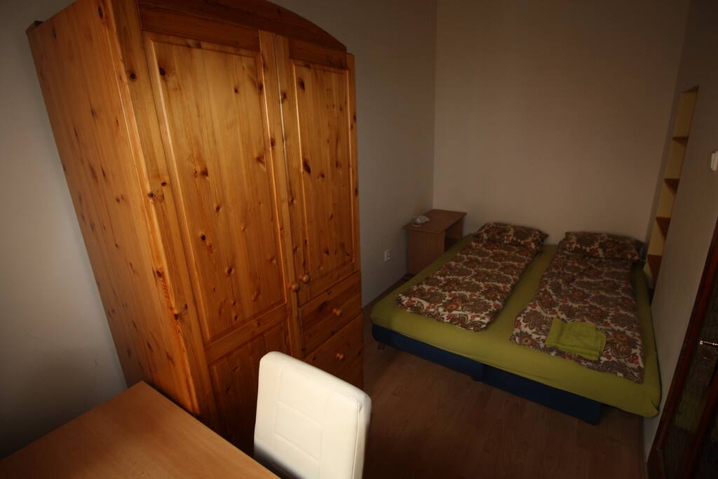 your private bedroom for 2 persons , 2 beds , writing desk , wardrobe