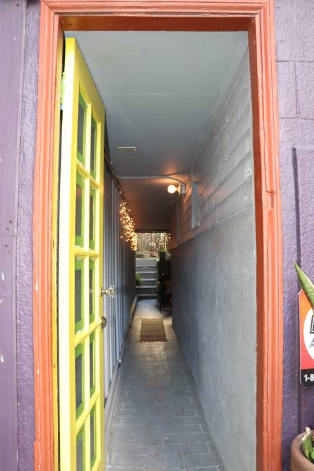 Front door and lit hallway entrance.