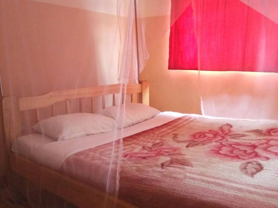 Bed under mosquito net
