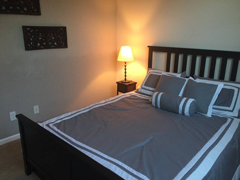 Private Bedroom for two with mirrored closet and drawer space under the bed.