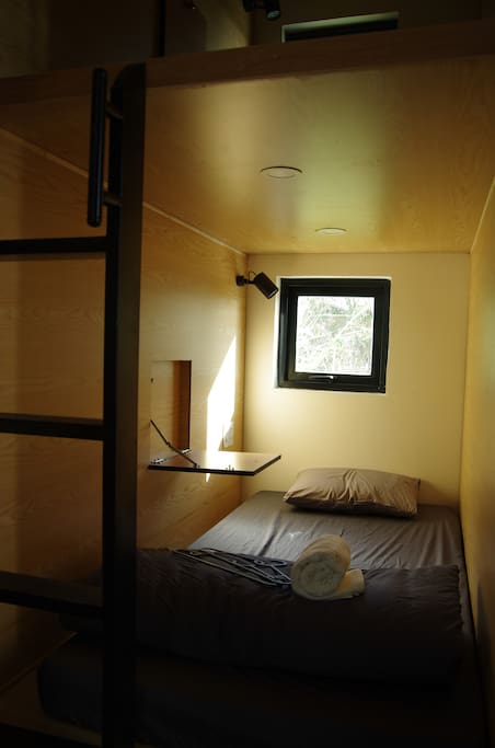Each bed has its own table, window, curtain, lighting