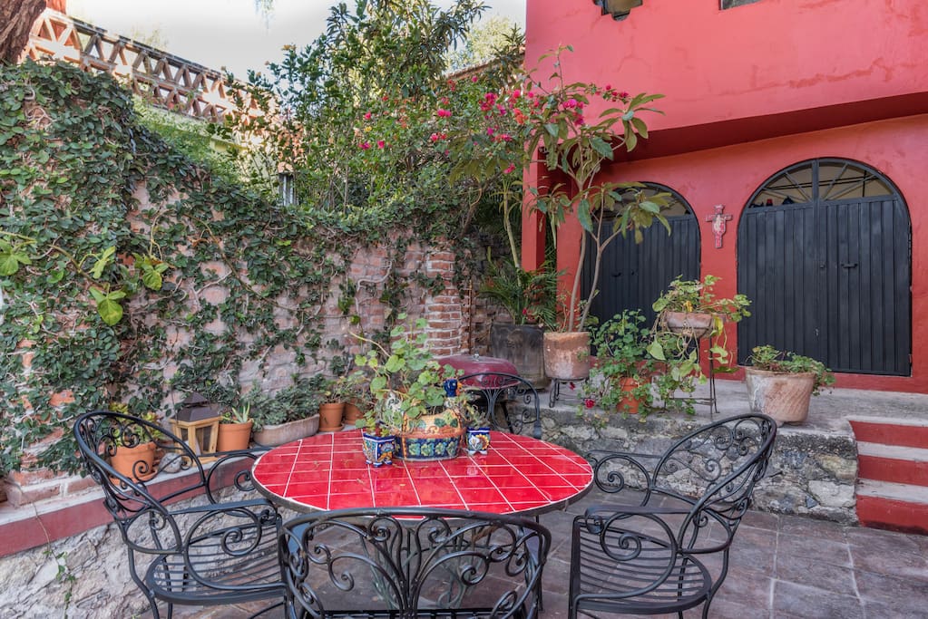 Cozy outdoor seating area with small yard for pets.