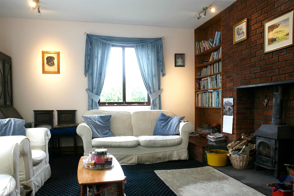 Large living room with real coal fire and lots of books and bard games for you to enjoy