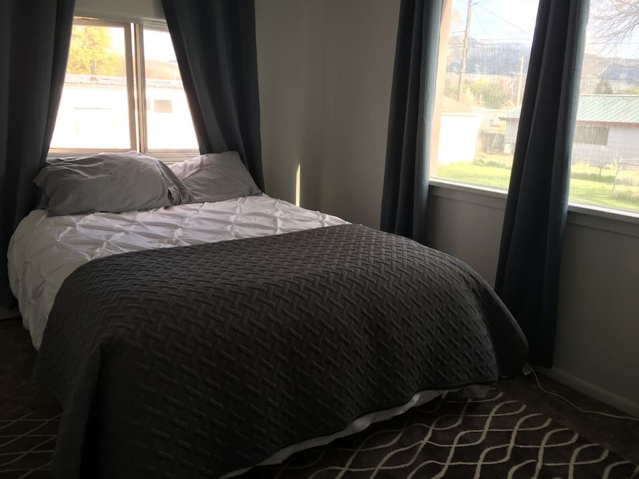 Big windows allow natural light in daytime, but blackout curtains are hung to allow for good sleep for those that wish to sleep in.