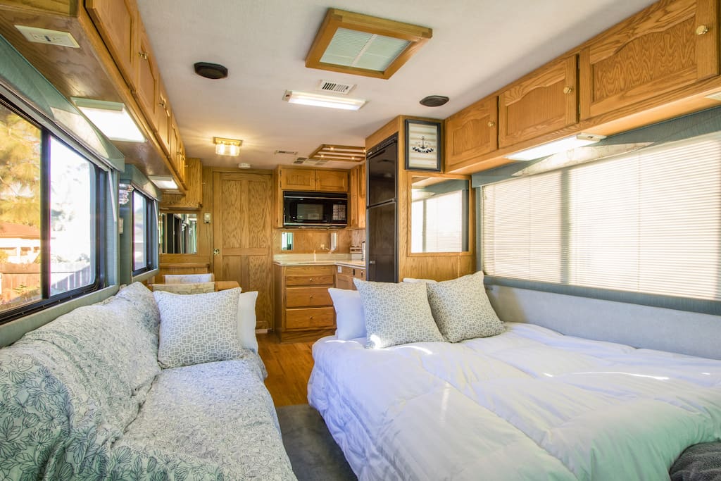 Living room converts to a second private bedroom at night with double and single bed. We also can provide an additional twin air mattress for larger groups that sits on the front carpeted area.