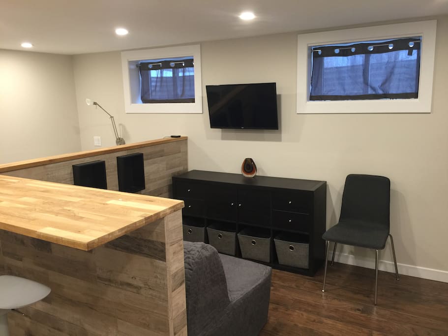 Open concept studio, small but with everything at your fingertips. TV with adjustable arm allows you to watch from counter, couch or bed.