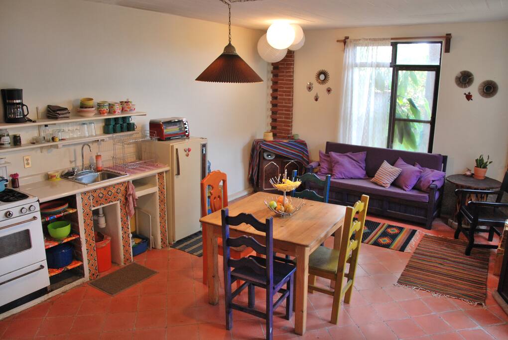 The colorful open plan kitchen-living room space ensures maximum socialization and relaxation.