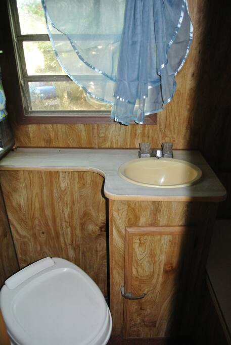 Running water in bathroom with a toilet. Not intended for "solids".