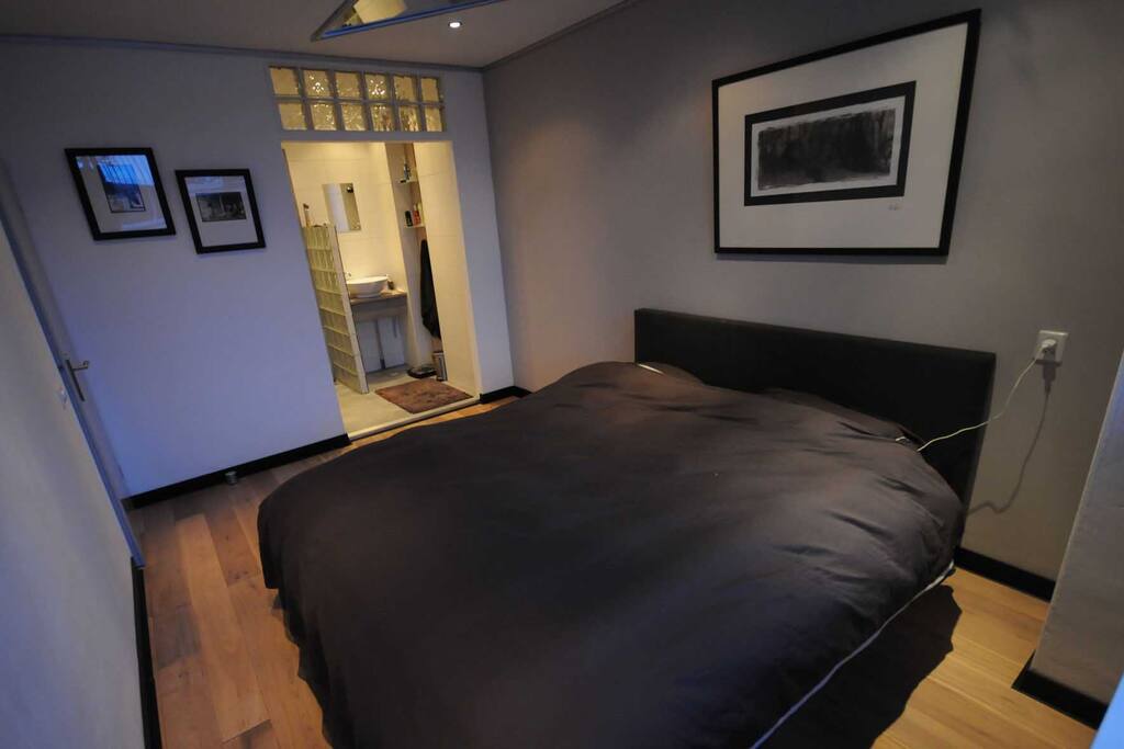 Super kingsize bed with walk-in shower
