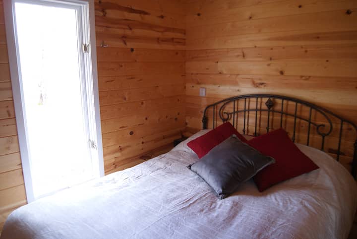Cozy bedroom space for queen bed with down comforter in winter, quilt in warm months.