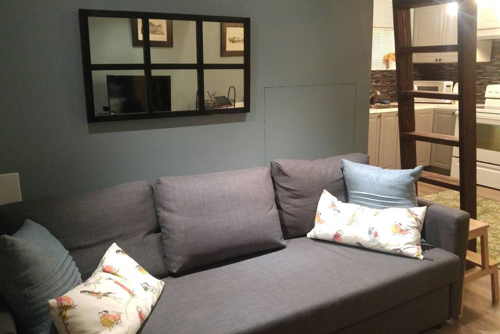 queen sofa bed converts in seconds. linens and duvet stored inside.