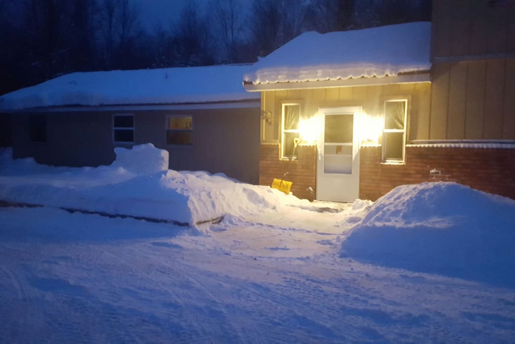 Well lit, and plowed, entry way.