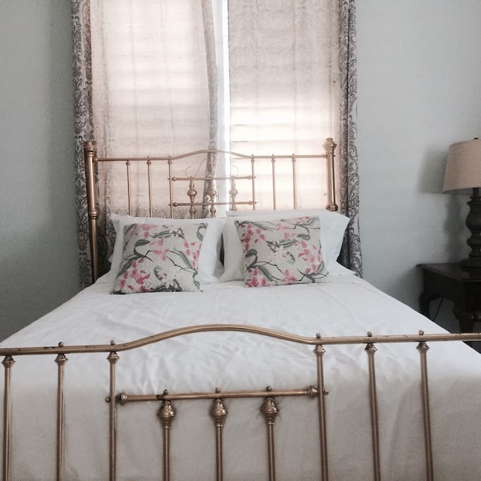 Large bedroom with queen size bed.