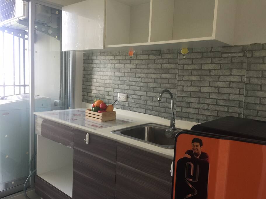 Kitchen with refrigerator
