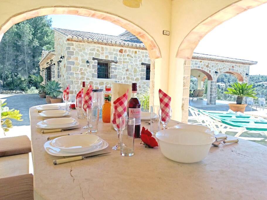 Barbecue with marble table and benchs.