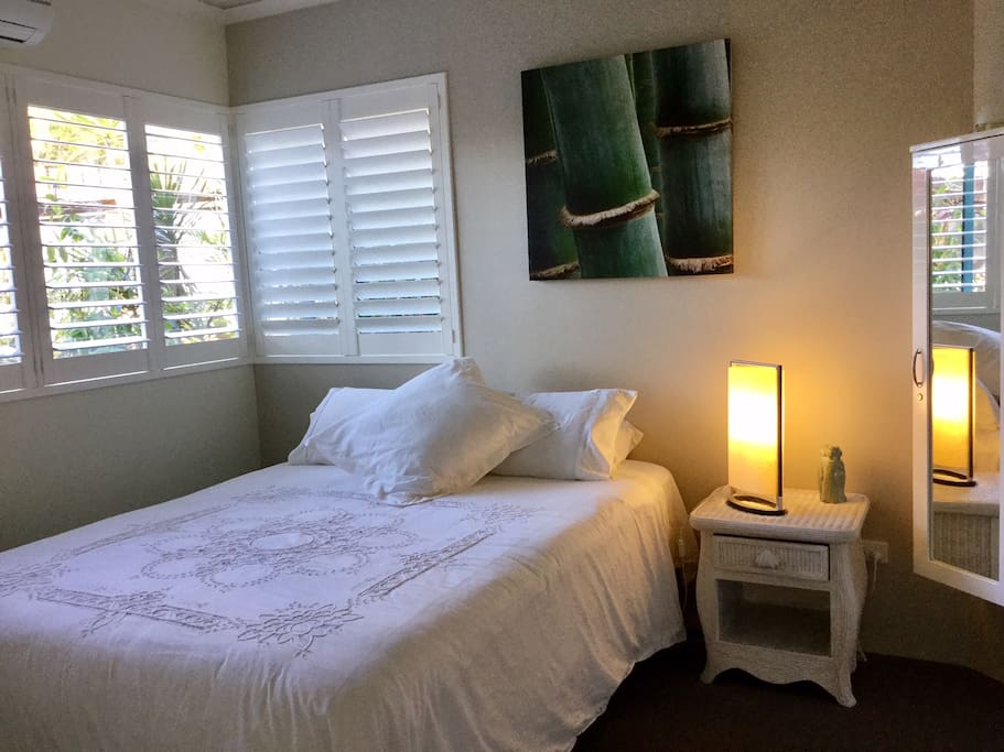 Master bedroom with Queen bed, wall TV, ceiling fan and reverse cycle A/C