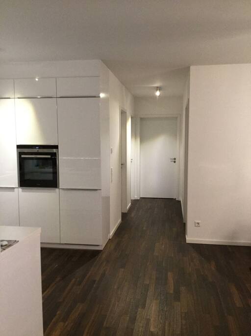 Hallway to room passes kitchen