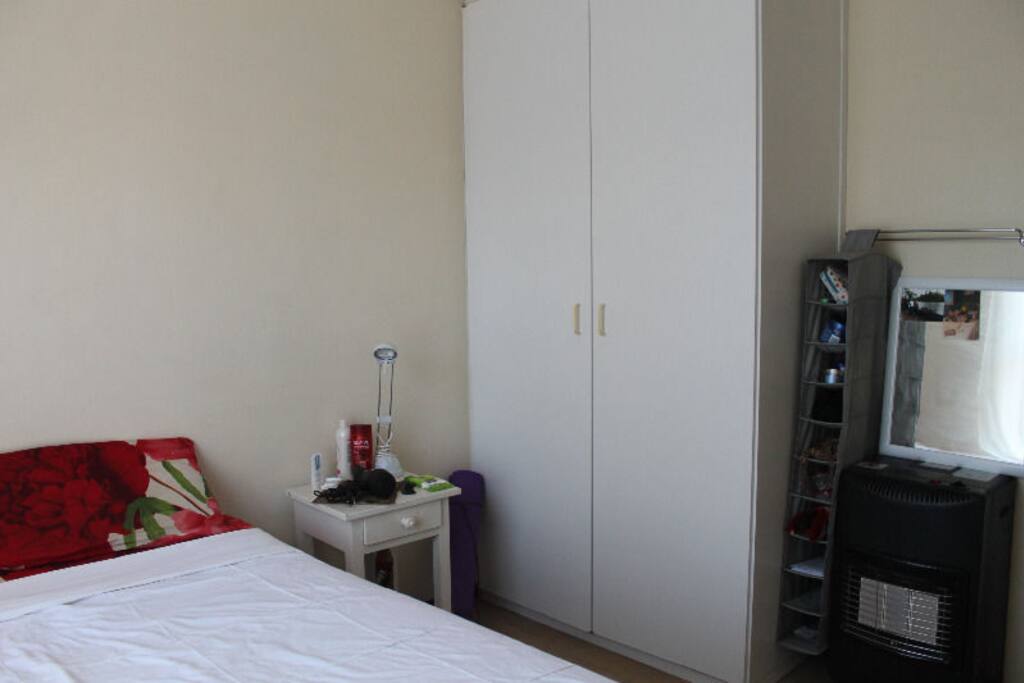 A lovely double bed and a huge wardrobe