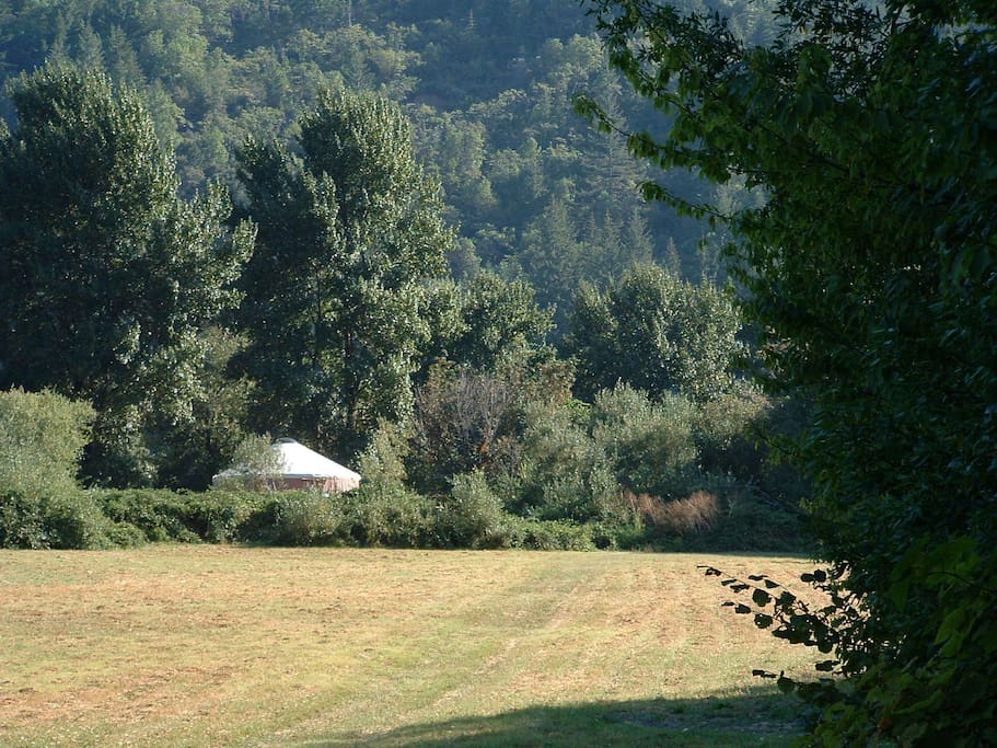 Two story Riverview Yurt across the meadow