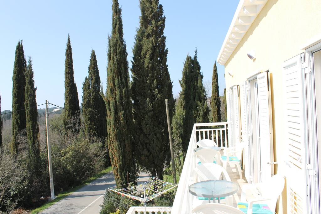 Balcony with view over cypresses