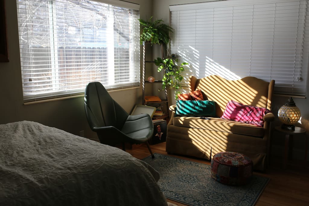Our cozy retro living space complete with a comfy little sofa and a record player to enjoy our thrifted record collection!