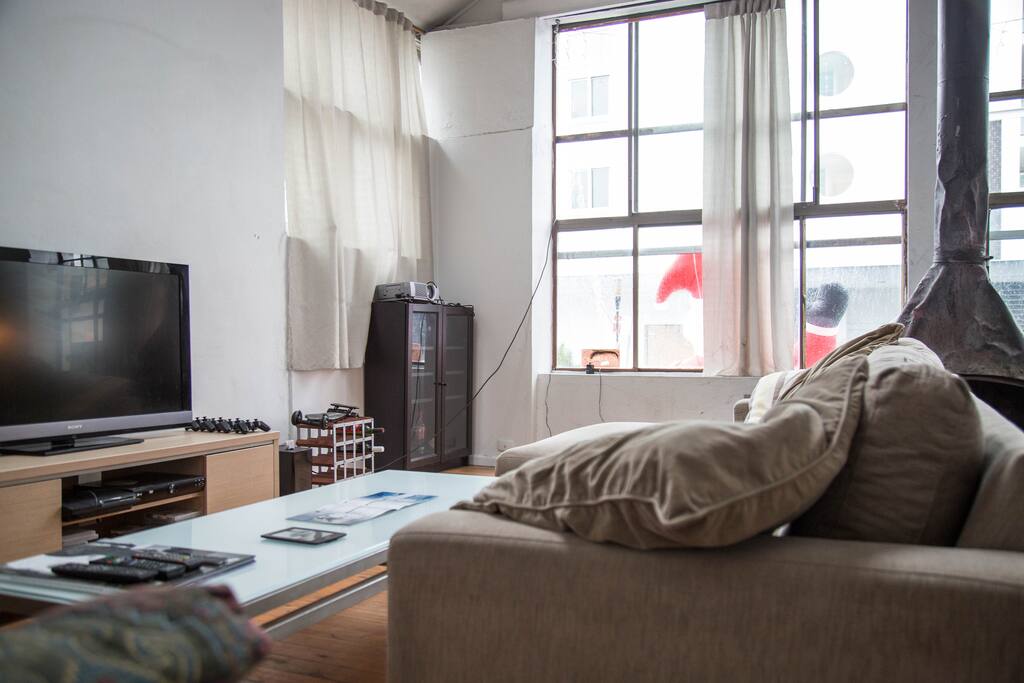 Laidback large comfortable couches and TV