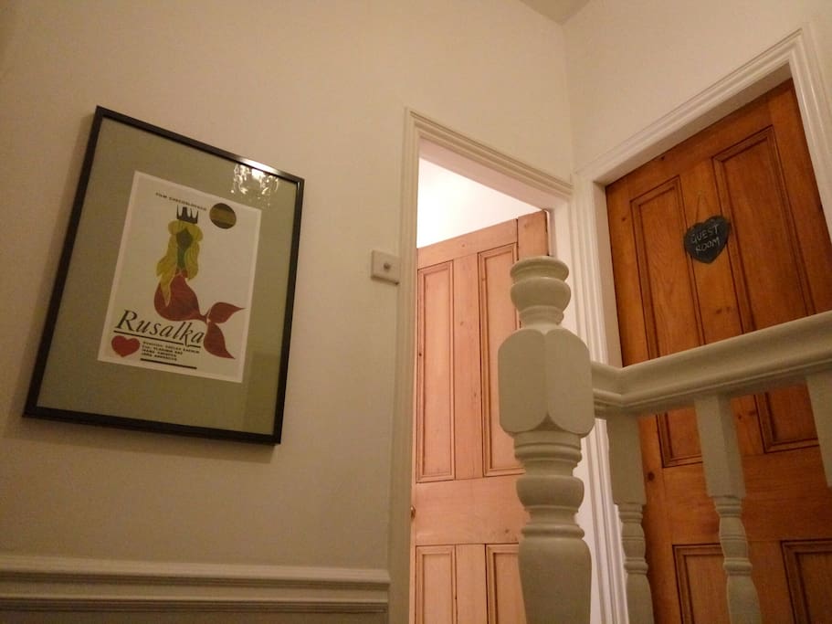 The guest room is conveniently located right next to the bathroom.