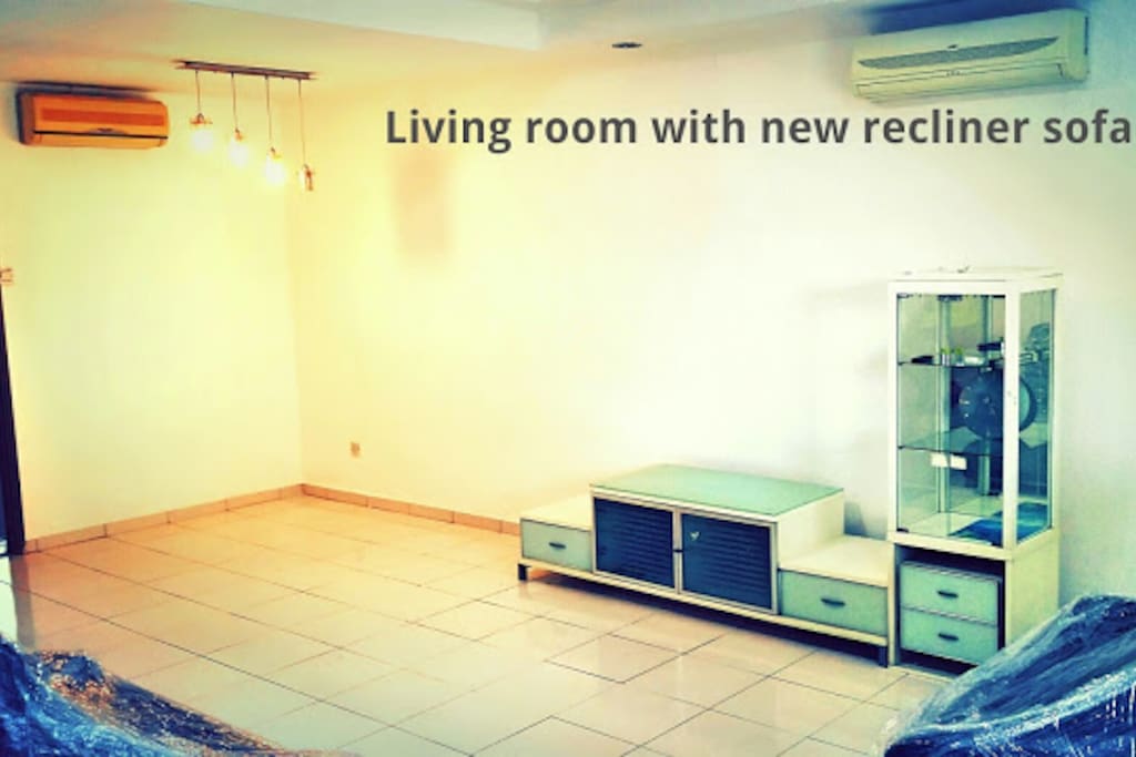 Spacious living room with 2 sets of Air conditioning.
