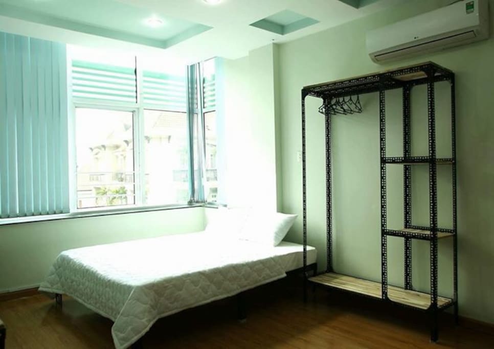 The cozy studio with full necessary amenities: nice decor closet, hangers, comfortable double bed, iron, working desk, dinning table, television, water- tea- coffee.