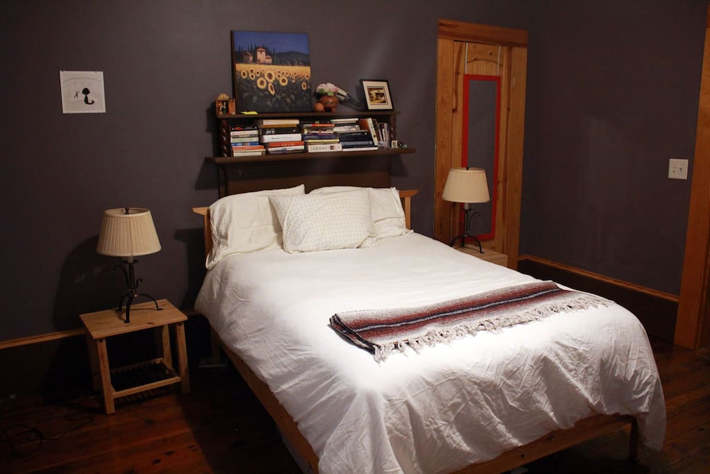 Cozy full-sized bed with down comforter.