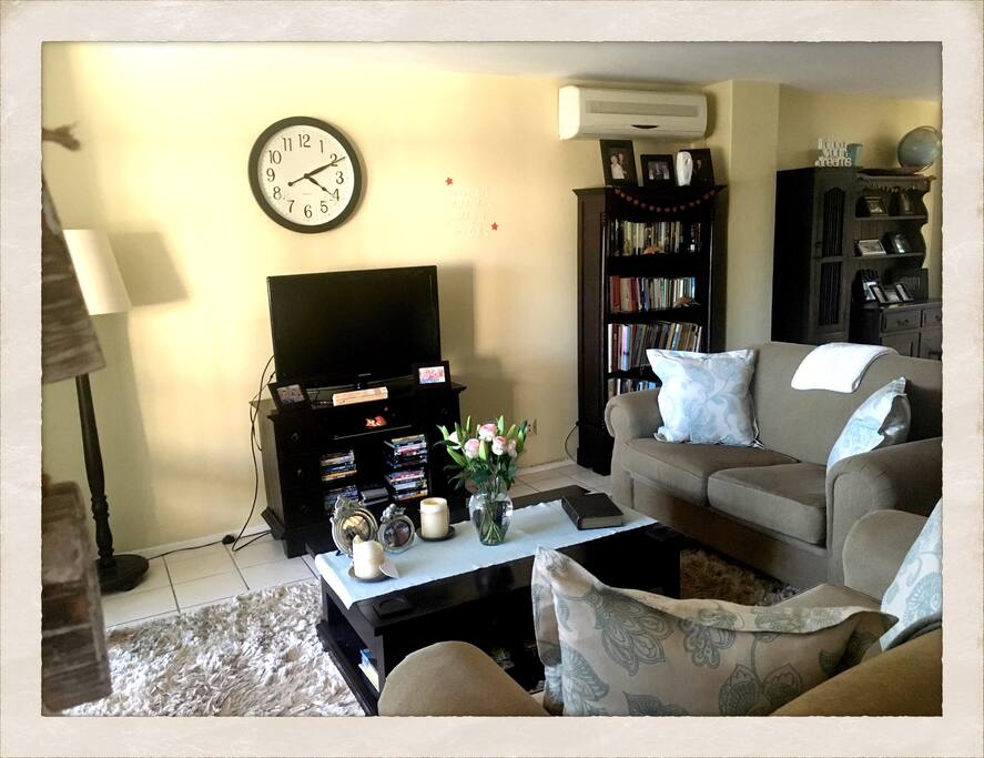 Shared living room area, with tv and dining room available for use.