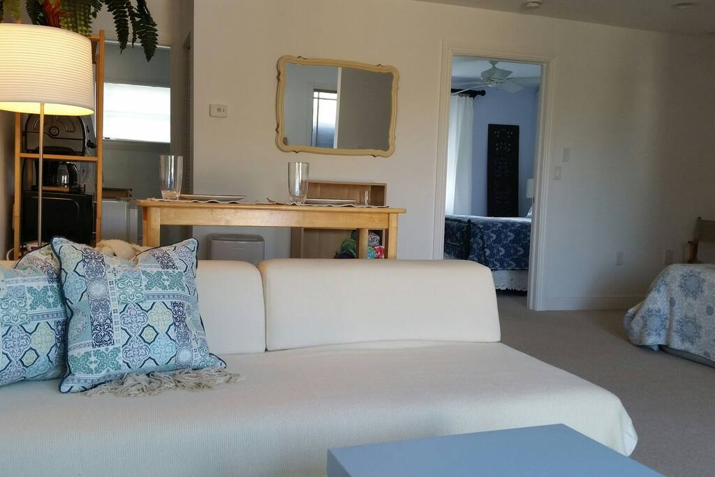 Outer living area with Queen air mattress and West Elm twin sofa