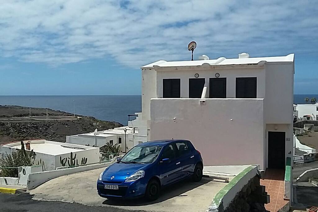 Front view of duplex apartment with parking space. Additional free parking is available nearby.