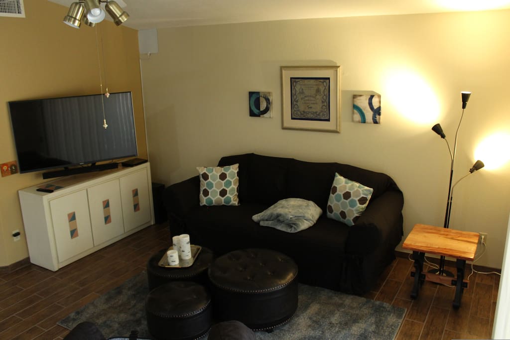 Living room with couch, electric recliner and tv/dvd. Wifi is included.