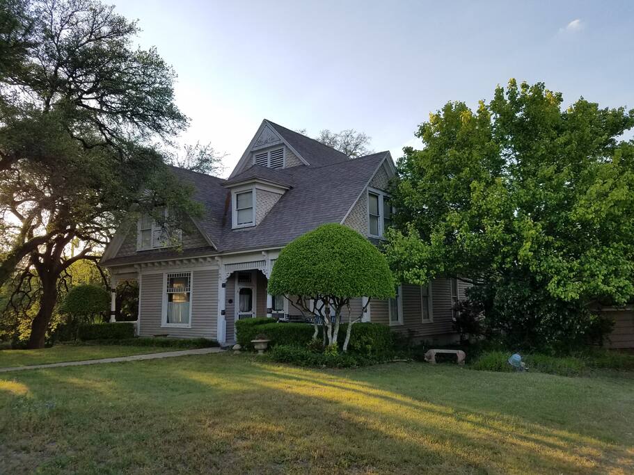 This is the view of our home from the driveway; it is the very first sight you will see upon entering the fence.
