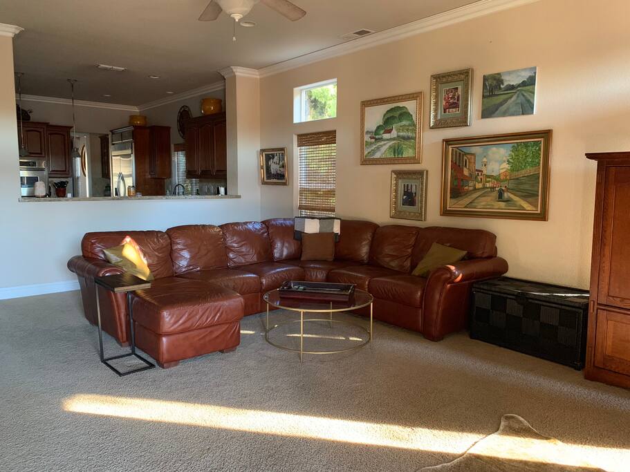 Sectional leather couch in family room
Facing big screen tv
