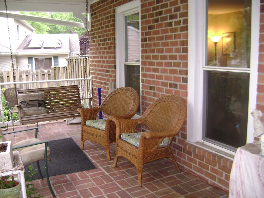 covered front porch with a swing
