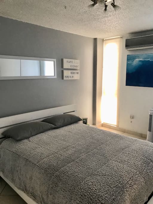 Air-conditioned Bedroom with comfortable Queen Size bed and Smart TV