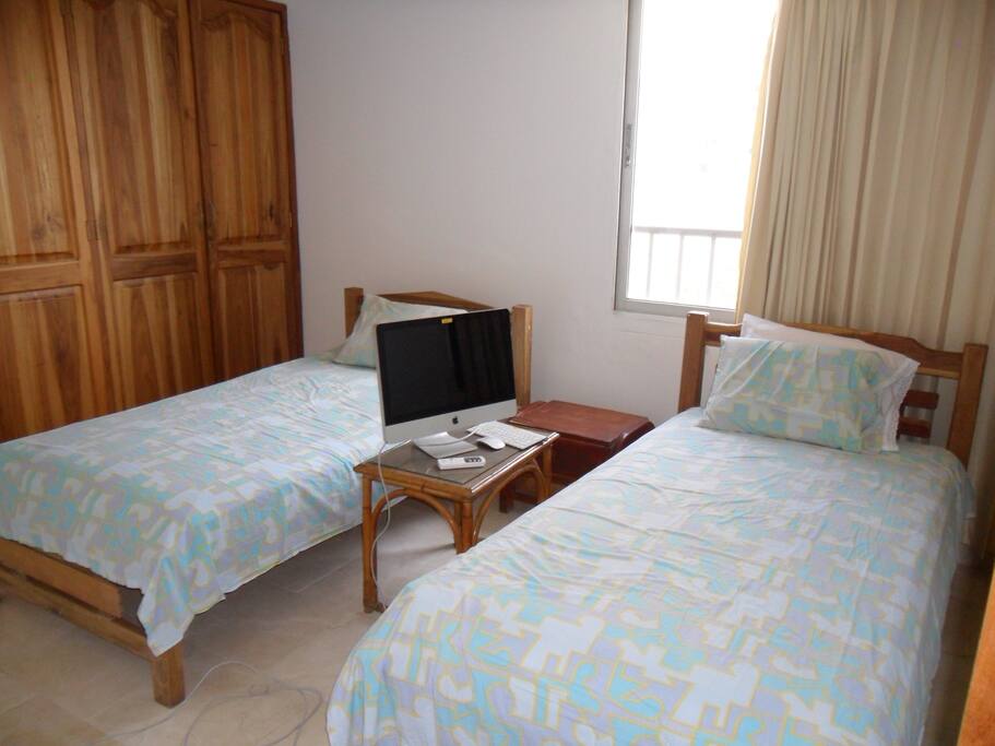two twin beds (this is same room with also a double bed). Sea view from the room.